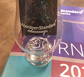 Engraved whisky glass sitting on top of Burns supper invite.